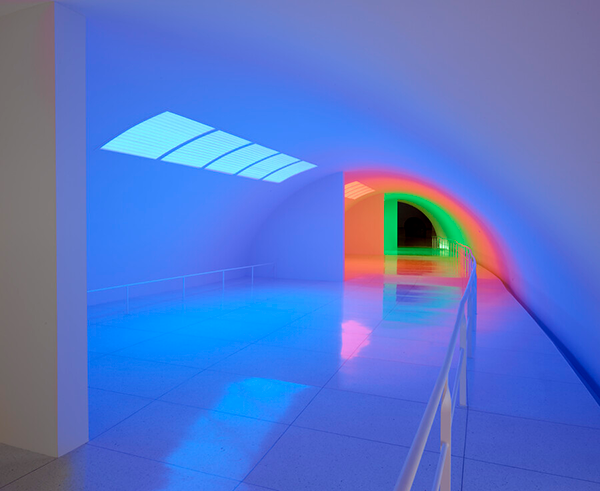 A tunnel infused with blue, red, and green light