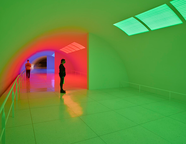 A tunnel infused with green, red, and blue light